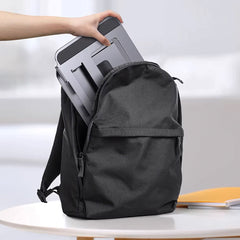 A Photo Of Adjustable Three-Layer Laptop Stand with Folding Storage and Cooling Base – Portable Carbon Steel Vertical Lifting Stand