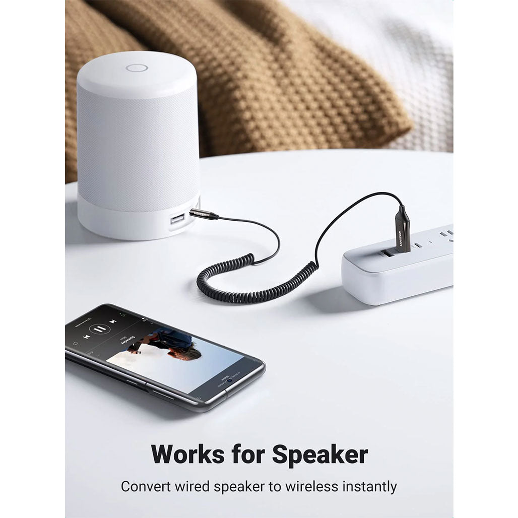 A Photo Of UGreen 70601 Bluetooth Aux Adapter – Car Aux Bluetooth v5.0 Receiver with 3.5mm Jack and Built-in Microphone for Stereo Music Streaming and Hands-Free Calls