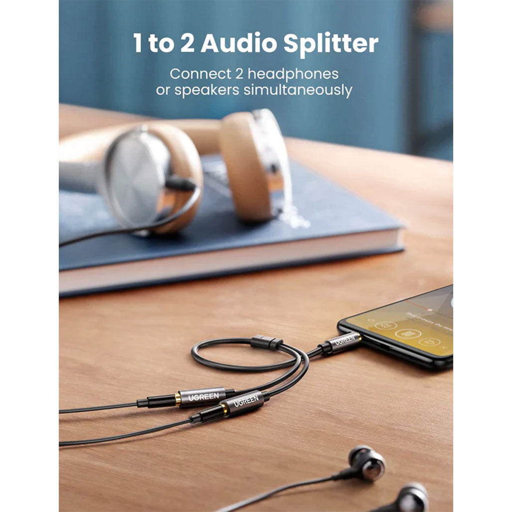 A Photo Of UGreen 10532 Headphone Splitter 2-Way Y 3.5mm Jack Aux Adapter | Hi-Fi Stereo Audio Extension for iPad, iPhone, PS4, Xbox, and More