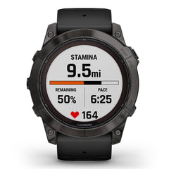 A Photo Of Garmin Fēnix® 7X Pro Sapphire Solar Edition - Titanium with Fog Gray/Ember Orange Band